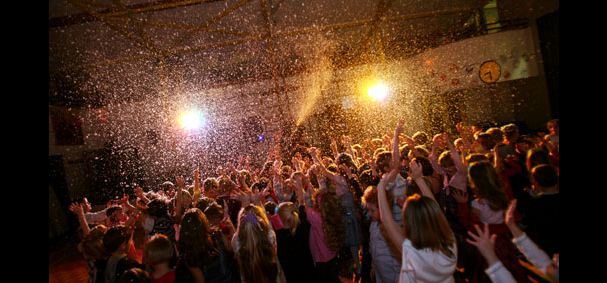 snow falling on crowd in disco